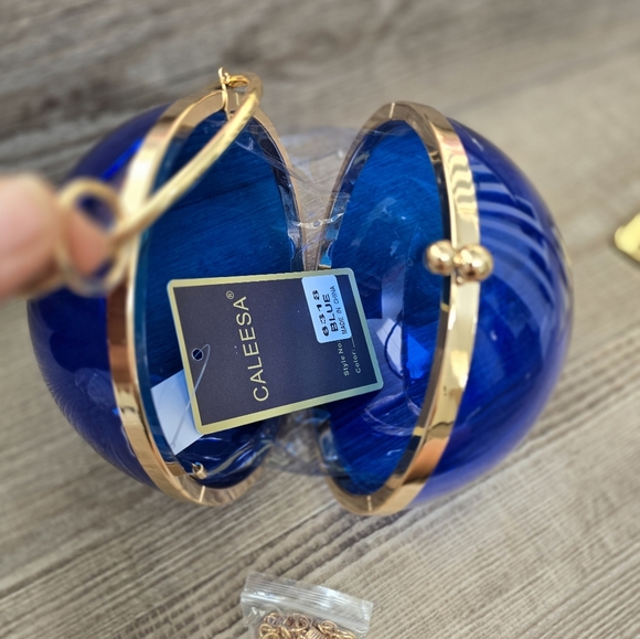 Cobalt blue wristlet round ball, gold trim and gold crossbody chain. - Picture 3 of 9